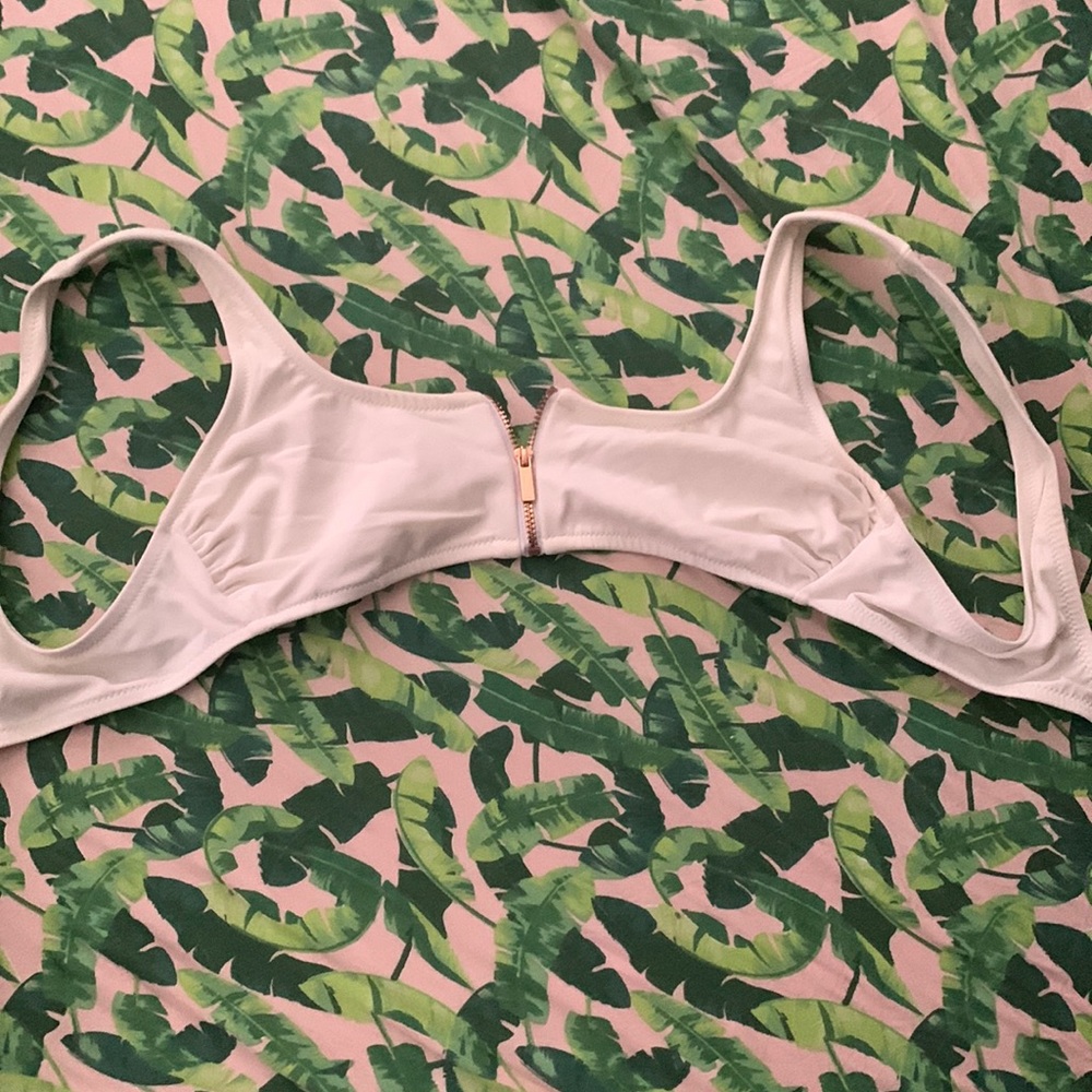 Small zip up swimsuit top. Super cute and removable padding.